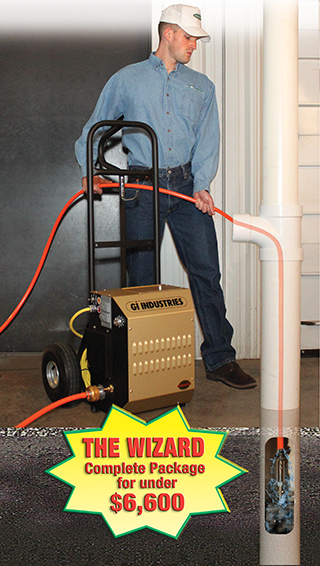 Cheerful young man using a vacuum cleaner